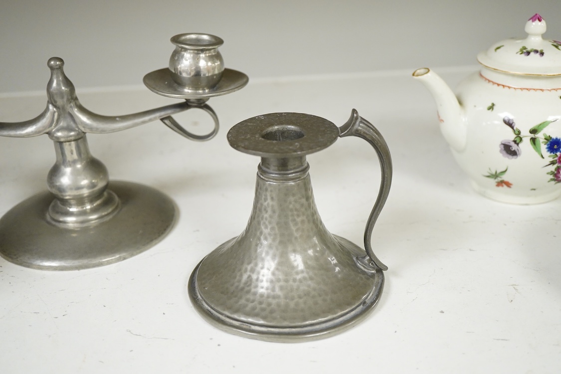 A Liberty Tudric pewter two branch candlestick, 22cm wide and two hammered candle holders.
